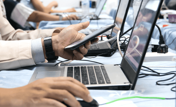 Website Graphics_Man at Table with Laptop Writing Replacement 1100x672 v7